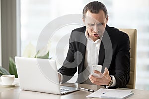 Businessman angry because of ill-timed phone call