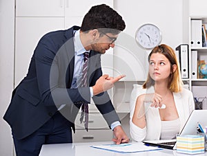 Businessman angry to female coworker