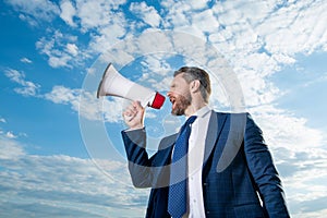 businessman announcer shout in loudspeaker on sky background