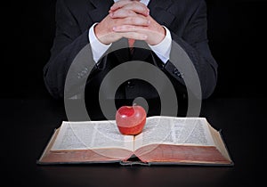 Businessman and apple on the book