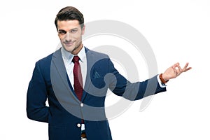 Businessman with arm out in a welcoming gesture