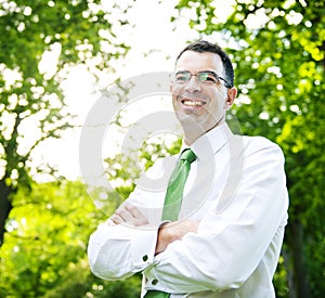 Businessman Arms Crossed In A Forest