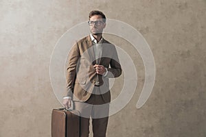 Businessman arranging his jacket while looking to side