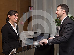 Businessman is arrived in hotel and is checking-in