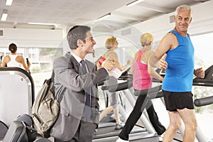 Businessman Arriving At Gym After Work photo