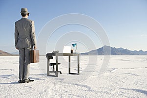 Businessman Arriving at Mobile Office Desk Outdoors photo