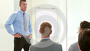 Businessman asking question during meeting