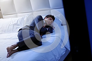 Businessman Asleep In Bedroom