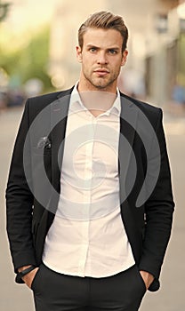 Businessman aspiring forward. Man well groomed elegant formal suit walks urban background. Businessman handsome