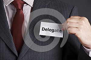 Businessman Attaching Delegate Badge To Jacket