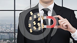 Businessman attracts dollar symbol