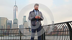 Businessman in autumn jacked counting money in New York. Businessman with dollars outdoor. Wealth rich businessman in