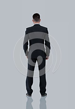 Businessman from the back - looking at something over a white ba