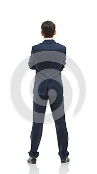 Businessman from the back - looking at something over a white ba