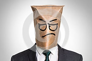 Businessman with a bag on the head - with sad face