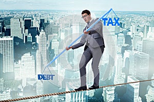 The businessman balancing between debt and tax