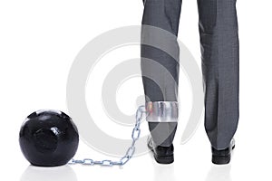 Businessman With Ball And Chain Attached To Leg