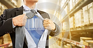 Businessman with barcode reader in warehouse