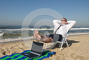 Businessman on beach relaxing