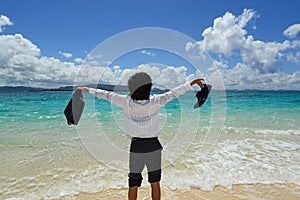Businessman on the beach