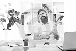 Businessman with beard and mustache gone mad with hammer in a hand. Frustrated office worker holding hammer poised ready