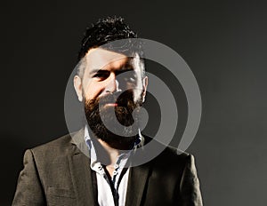 Businessman with beard and spiky hair in formal wear. Business confidence and elegance concept. Man in suit with