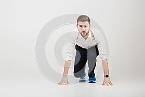 Businessman with beard in white shirt on position of start ready