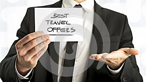 Businessman with Best Travel Offers Texts on Paper