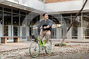 Businessman and bicycle in city to work with eco friendly transport. happy businessman professional riding a bicycle in