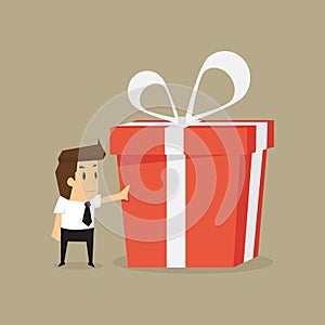 Businessman and a big gift box