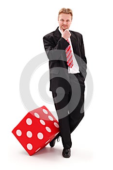 Businessman with big red dice