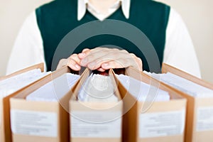 Businessman with binders at office.