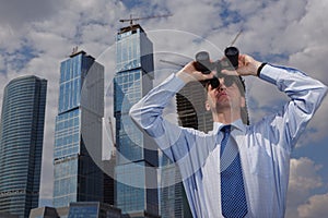 Businessman with binoculars