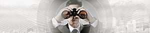 Businessman with binoculars. photo