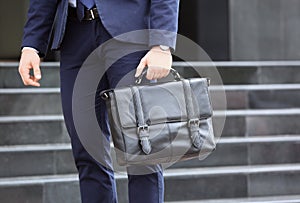 Businessman with black briefcase in hand