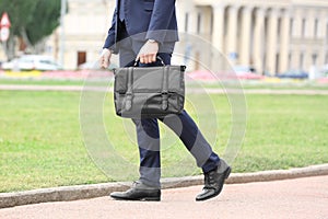 Businessman with black briefcase in hand