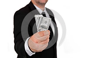Businessman in black business suit, holding cash in hands - United stage dollar bill; clipping path - Concept of the fight against