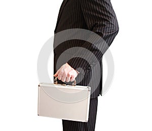 Businessman in black suit holding a white suitcase