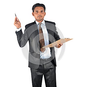 Businessman in black suit with pen and clipboard presenting