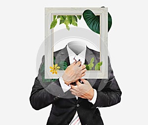 Businessman in black suit with picture frame, and flowers with leaves. Digital collage modern art