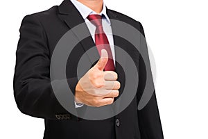 Businessman in black suit with red necktie thumb up