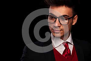 Businessman in black suit wearing glasses