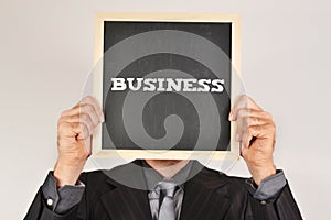 Businessman with a blackboard