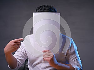 Businessman with Blank Paper Mask Covering His Face