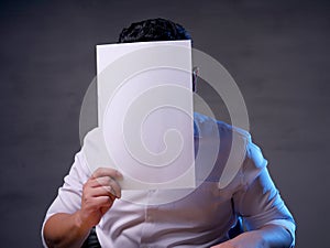 Businessman with Blank Paper Mask Covering His Face