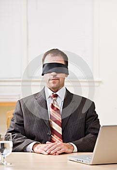 Businessman in blindfold