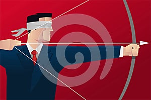 Businessman blindfold hitting target with bow and arrow