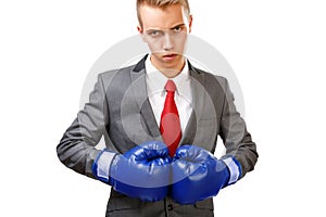 Businessman with blue boxing gloves