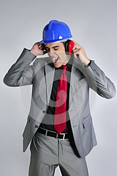 Businessman blue hardhat and safety headphones