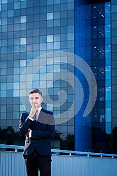 Businessman and blue skyscraper